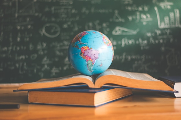 World globe on book. education school concept Premium Photo
