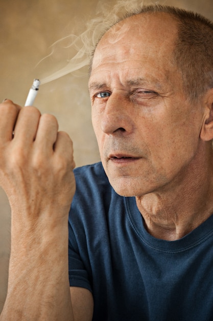 Free Photo | Worried Mature Man Sitting, Smoking And Thinking About ...