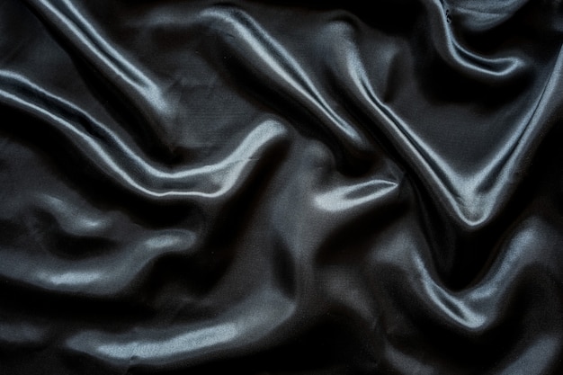 Premium Photo | Wrinkle black satin cloth texture