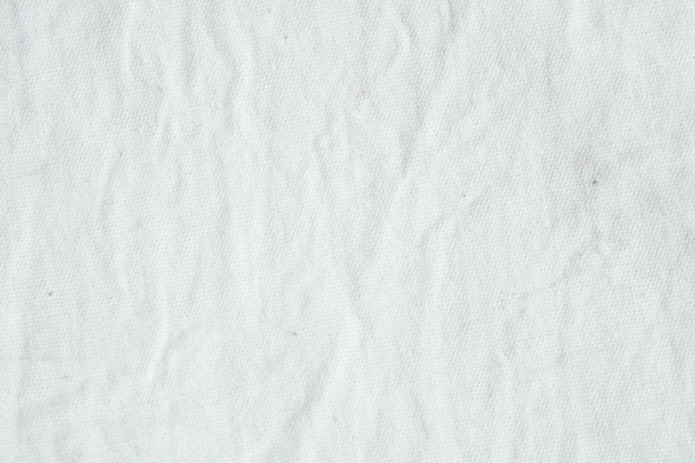 Premium Photo | Wrinkled white cotton canvas fabric textured background ...