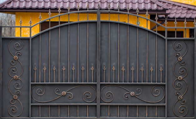 Premium Photo | Wrought-iron gates, ornamental forging, forged elements ...