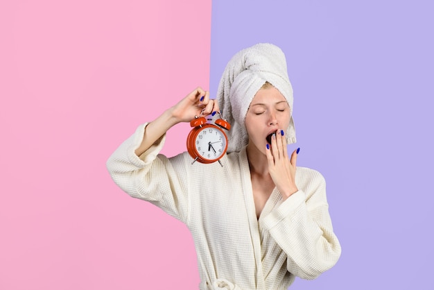 Premium Photo Yawning Girl With Alarm Clock People Sleeping And Bedtime Concept Sleepy Woman 0172