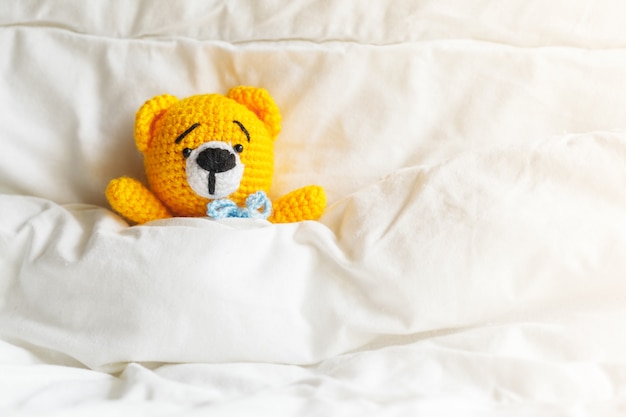 bed with teddy bear