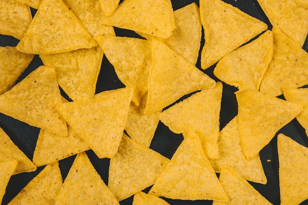 Download Free Photo Yellow Mexican Nachos Chips Over Black Background PSD Mockup Templates