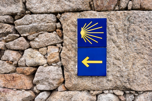 Premium Photo | Yellow scallop shell, touristic symbol of the camino de ...