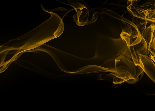 Premium Photo Yellow Smoke Abstract On Black Background