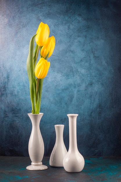 Download Premium Photo Yellow Tulips And Empty Vases On Table Yellowimages Mockups