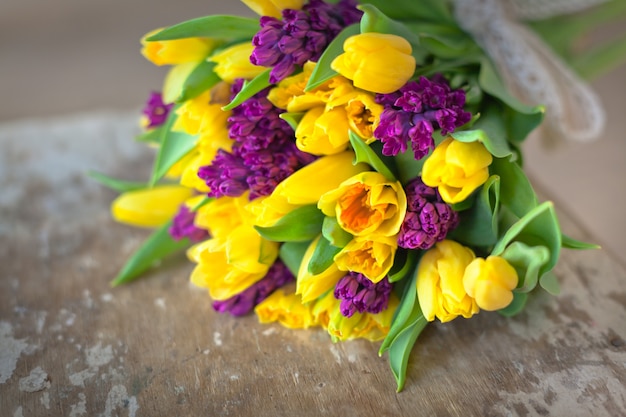 Premium Photo Yellow Tulips And Purple Hyacinths Flowers Bouquet