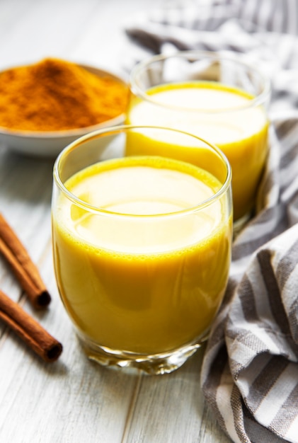 Premium Photo | Yellow turmeric latte drink