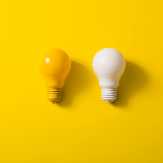 Premium Photo | Yellow and white bulb on yellow background