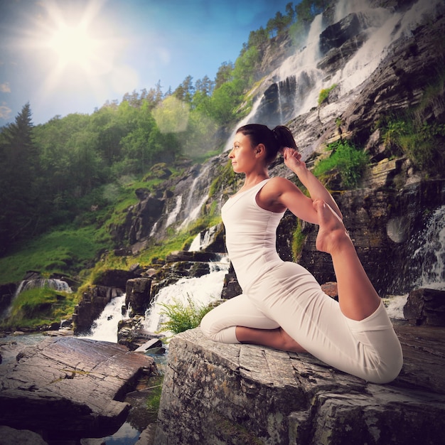 Premium Photo Yoga In A Natural Landscape With Waterfall 9900