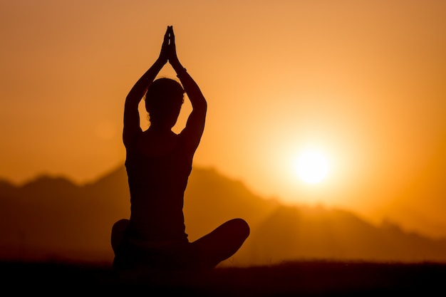 Yoga practice in mountains Photo | Free Download