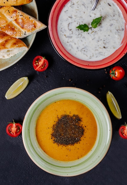 Free Photo | Yogurt and lentil soup with herbs and spices.
