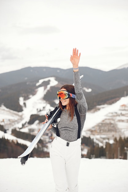 Free Photo | Young and active brunette skiing. woman in the snowy ...