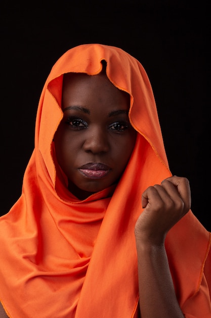 Premium Photo | Young angolan girl wearing dress and turban studio ...