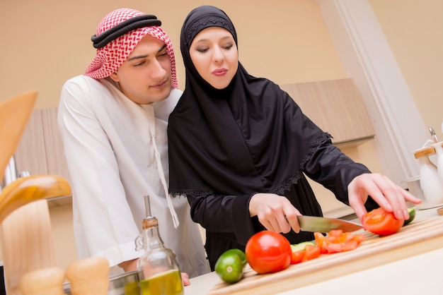 Young arab family in the kitchen Premium Photo