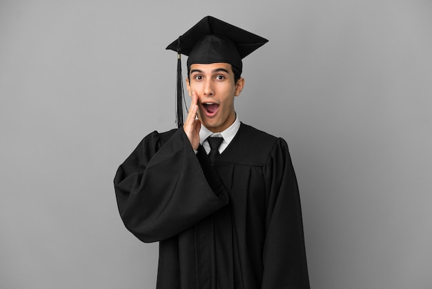 Premium Photo | Young argentinian university graduate isolated on grey ...