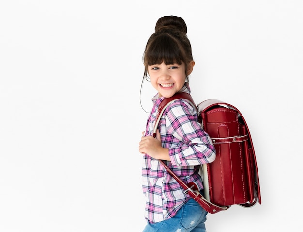 Premium Photo | Young asian kid student with a backpack studio portrait