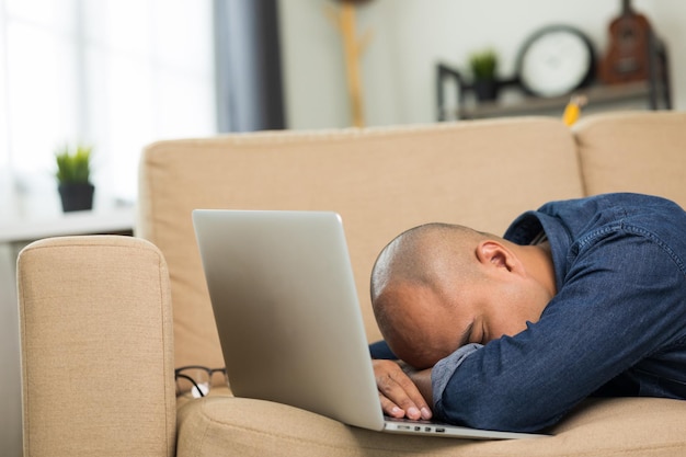 Premium Photo Young asian  man lay down on sofa in living  