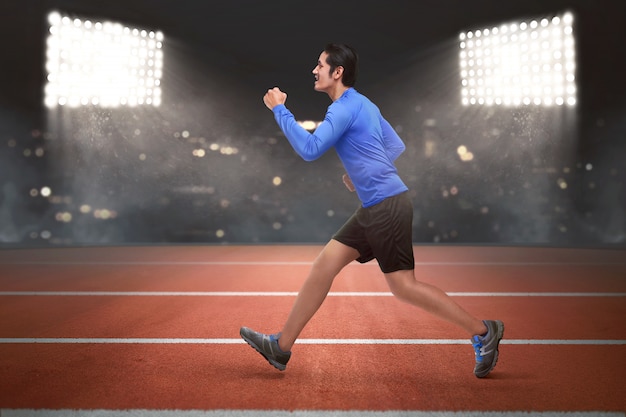 Young asian runner man running Premium Photo