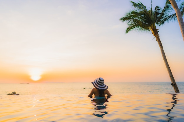 Young asian woman on a beautiful beach landscape | Free Photo