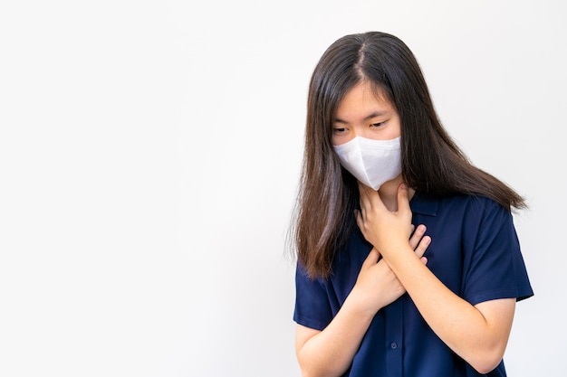 Premium Photo | Young asian woman coughing while wearing n95 mask