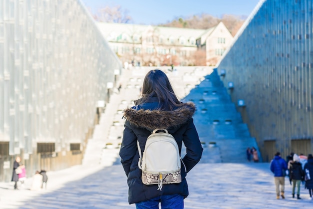 Young Asian Woman Traveler With Backpack Traveling Into The Ewha