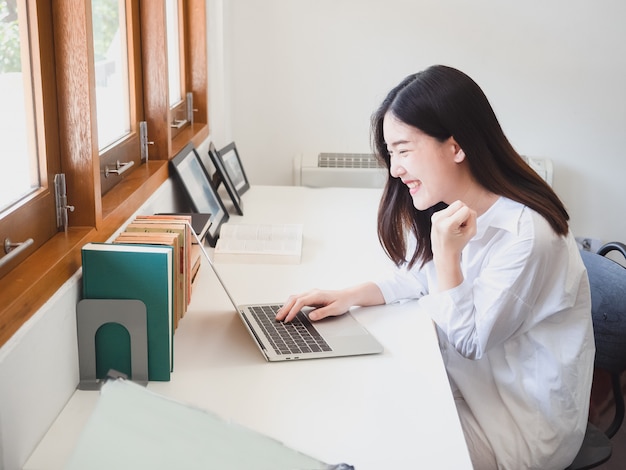 Premium Photo | Young asian woman working with computer in room