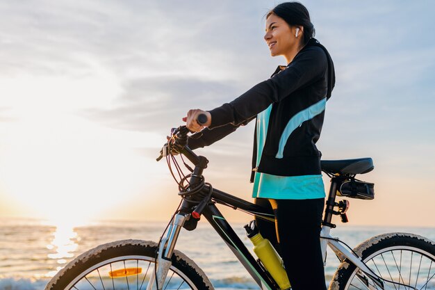 Free Photo | Young attractive slim woman riding bicycle, sport in ...