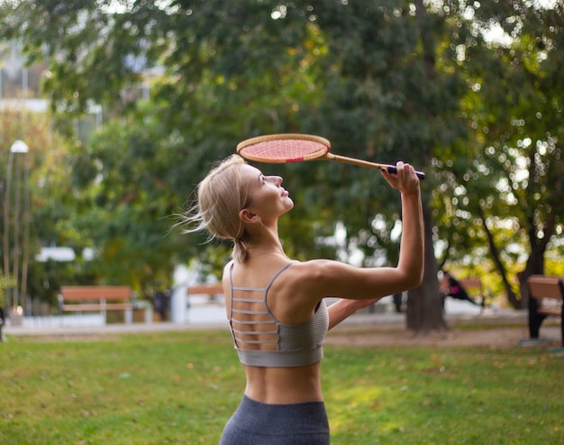 Young attractive sport woman playing badminton Premium Photo