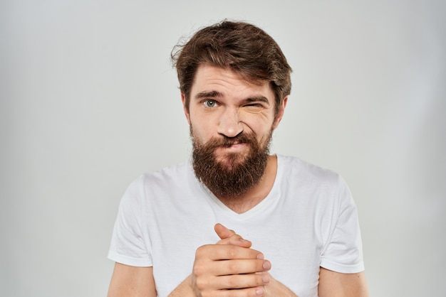 Premium Photo | Young bearded man with discontent expression