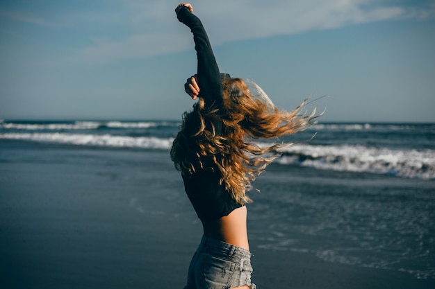 Young Beautiful Girl Posing On The Beach Ocean Waves Bright Sun And