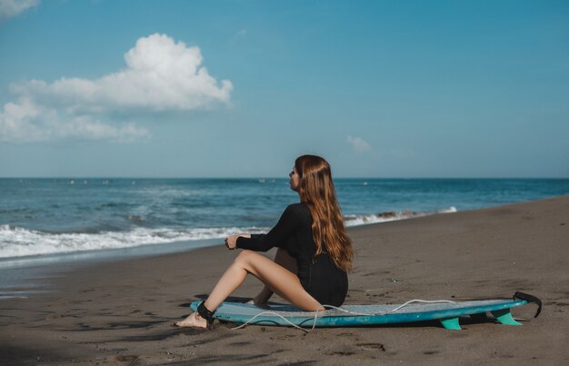 Free Photo Young Beautiful Girl Posing On The Beach With A Surfboard Woman Surfer Ocean Waves 