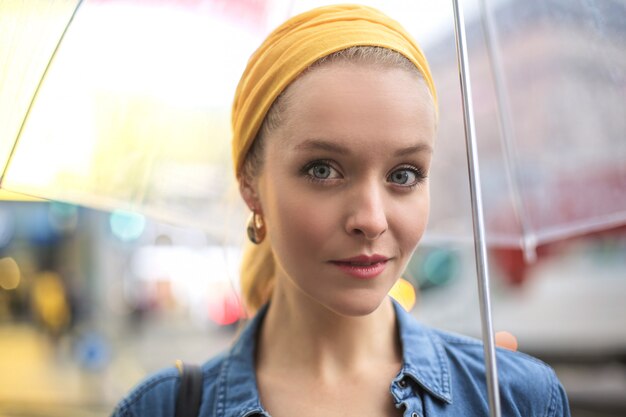 Young Beautiful Girl Walking Under The Rain With A Transparent