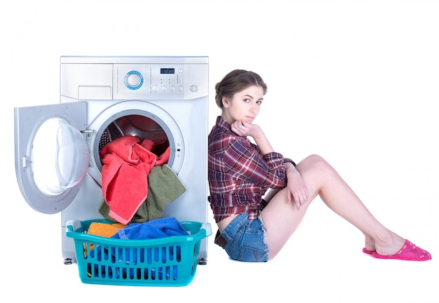 Premium Photo Young Beautiful Woman Doing Laundry In The Washing Machine 8758