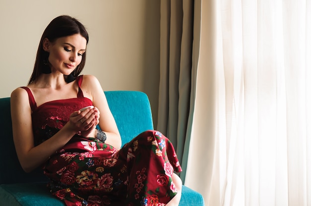 Premium Photo | Young beautiful woman drinking coffe at home