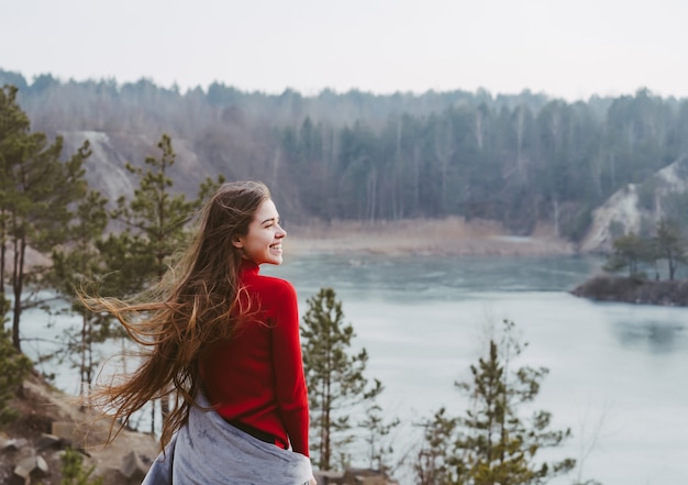 Young beautiful woman posing on a lake Free Photo