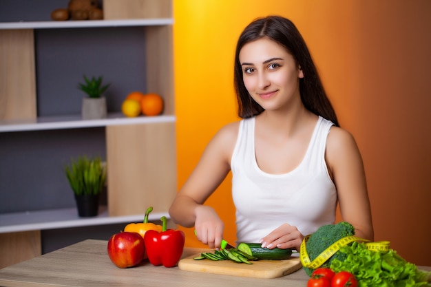 Premium Photo | Young beautiful woman preparing wholesome diet salad