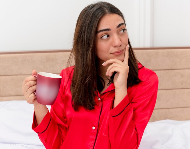 Free Photo Young Beautiful Woman In Red Pajamas Relaxing In Bed 8328