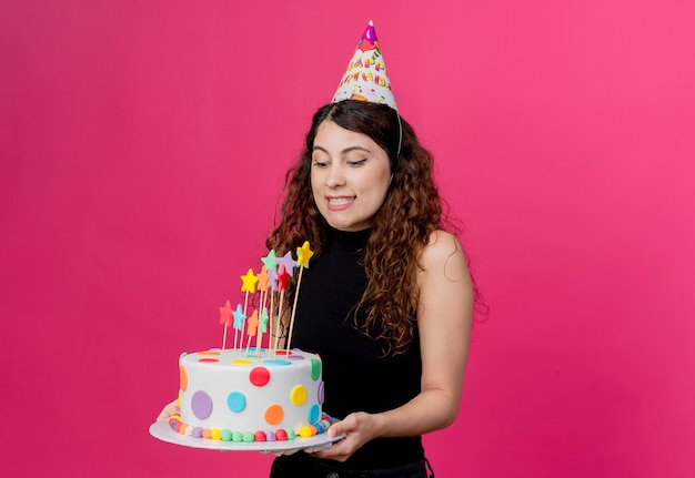 Free Photo | Young beautiful woman with curly hair in a holiday cap ...