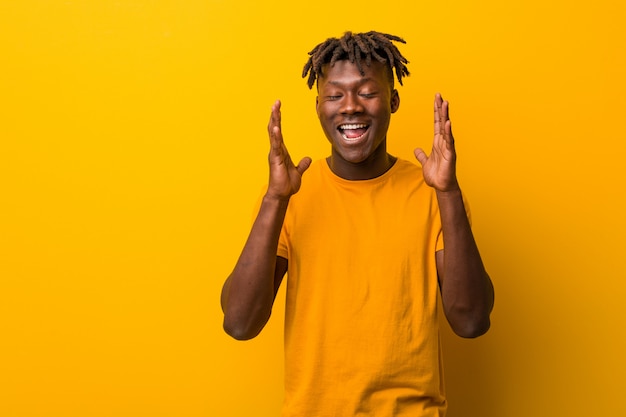 Premium Photo | Young black man wearing dreads joyful laughing a lot ...