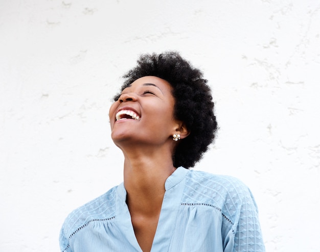 Premium Photo | Young black woman looking away and laughing