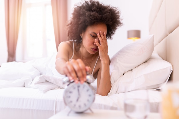 CAL: Releases - Page 2 Young-black-woman-waking-up-with-headache-sad-migraine-stressed-crying-disappointed-feeling-morning-sleepy-young-woman-stretching-hand-ringing-alarm-turn-it-off_1212-2522