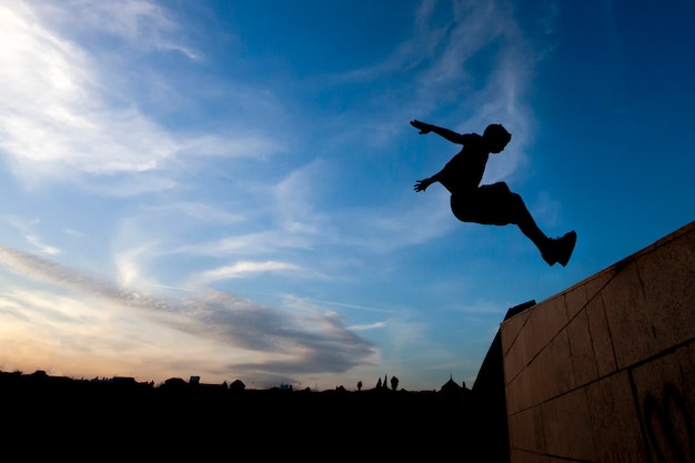 Premium Photo | Young boy practicing parkour