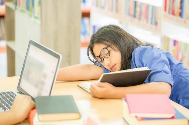 Young brown hair woman in glasses read book Free Photo