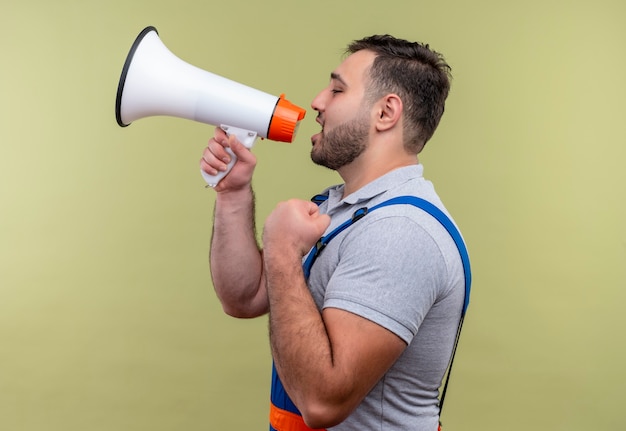 Free Photo | Young builder man in construction uniform shouting to ...