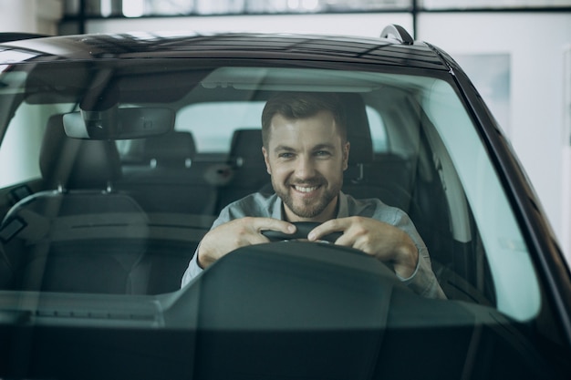 Free Photo | Young business man sitting in a car