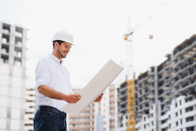 Premium Photo | Young businessman construction site engineer,close up.