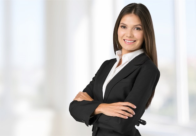 Premium Photo | Young businesswoman in suit on blurred background