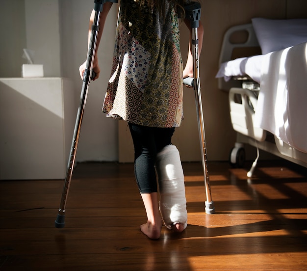 Premium Photo Young Caucasian Girl With Broken Leg In Plaster Cast